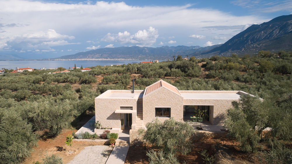 Stone hillside residence by Etsi Architects