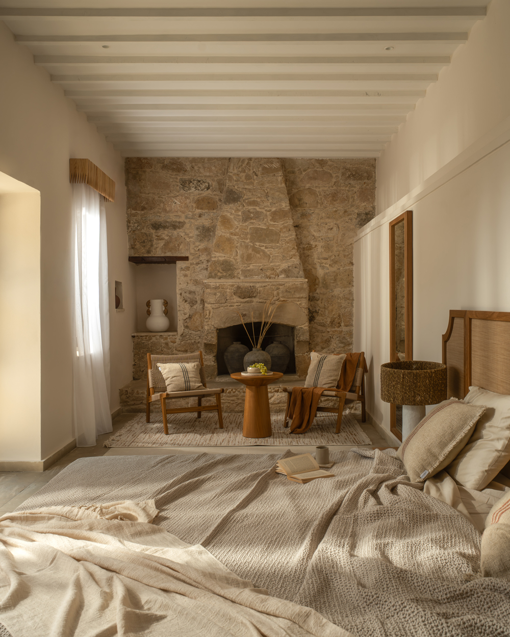 Lounge area with clean architectural lines contrasting the original stonework