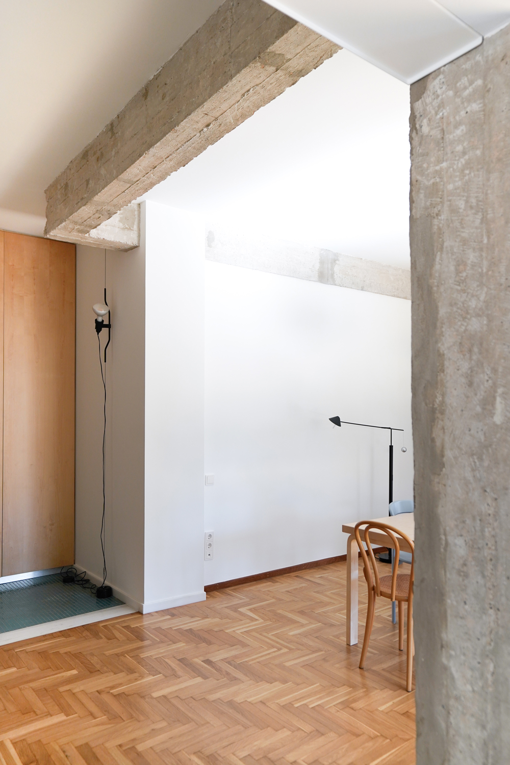 Exposed concrete column and beams revealed after removing interior wall.