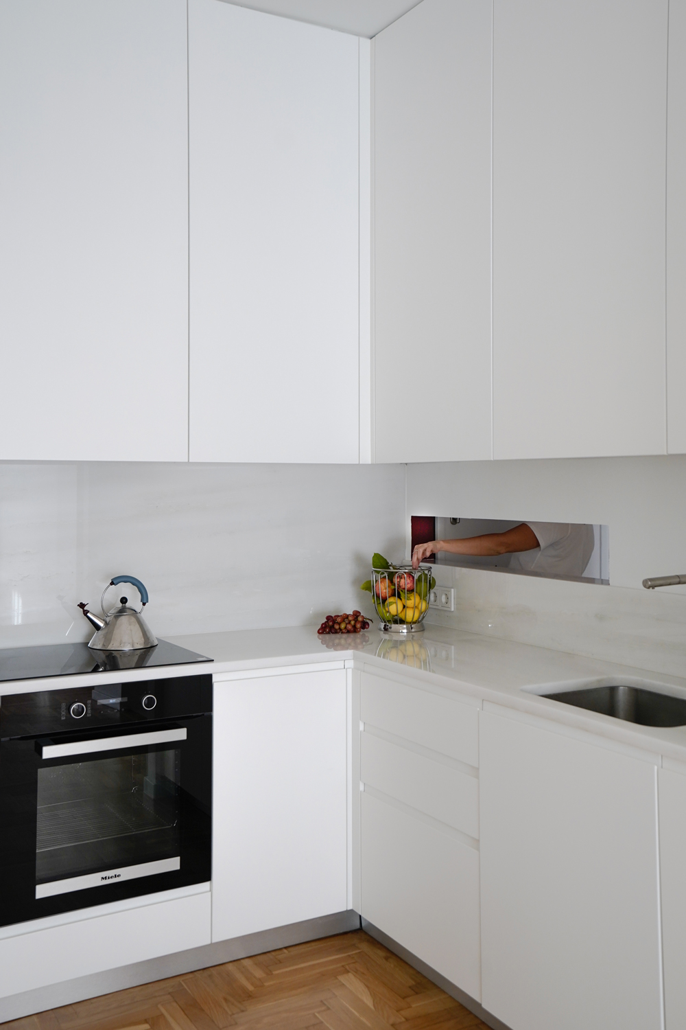 Relocated kitchen designed as built-in furniture with Dionysos marble countertop.