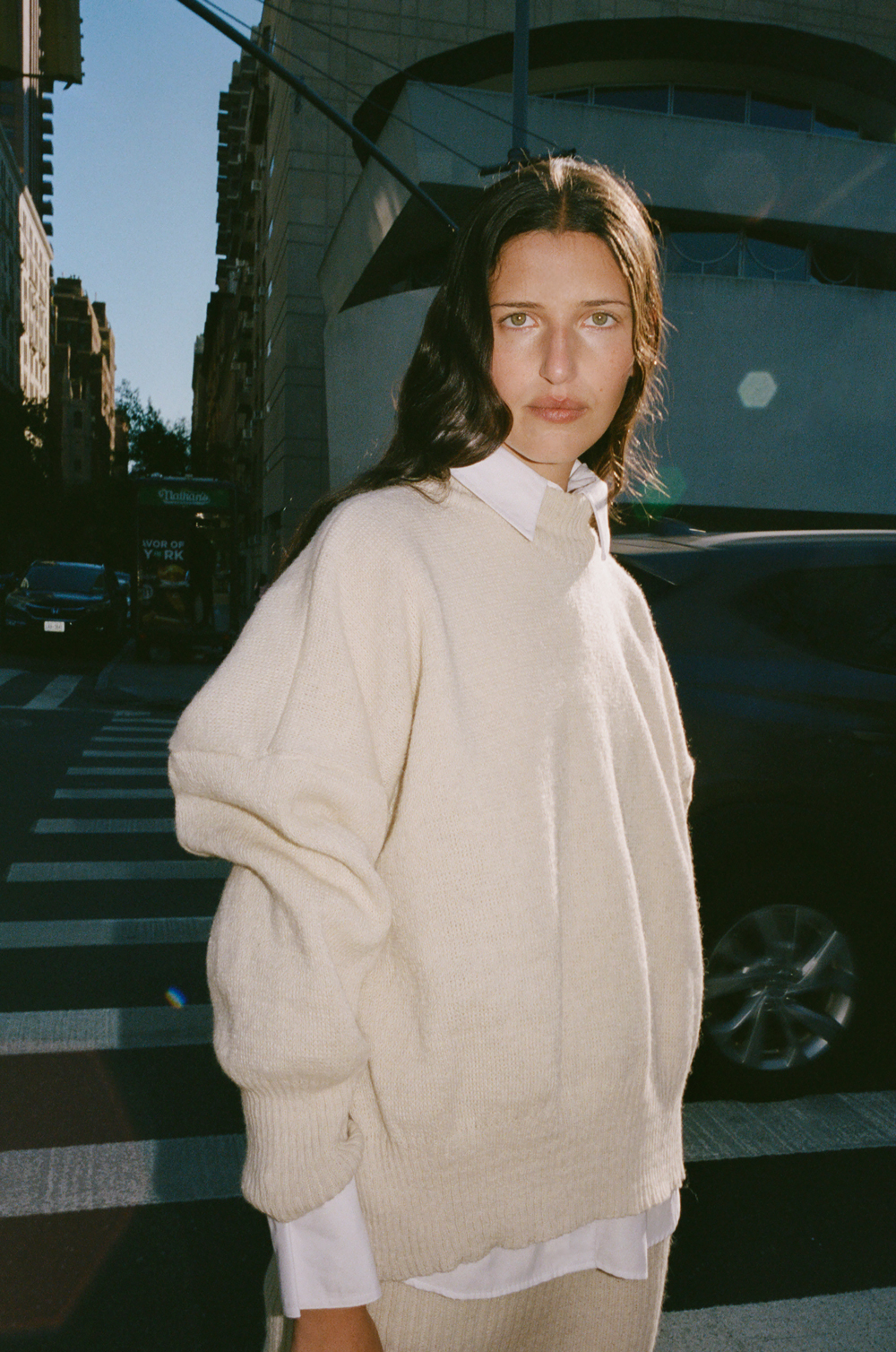 Model wearing a cream-coloured jumper from Nonna Lietta