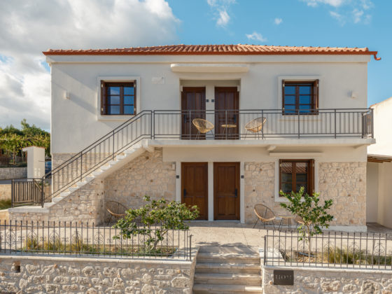 Exterior view of the renovated stone building blending with the traditional architecture of Afytos.