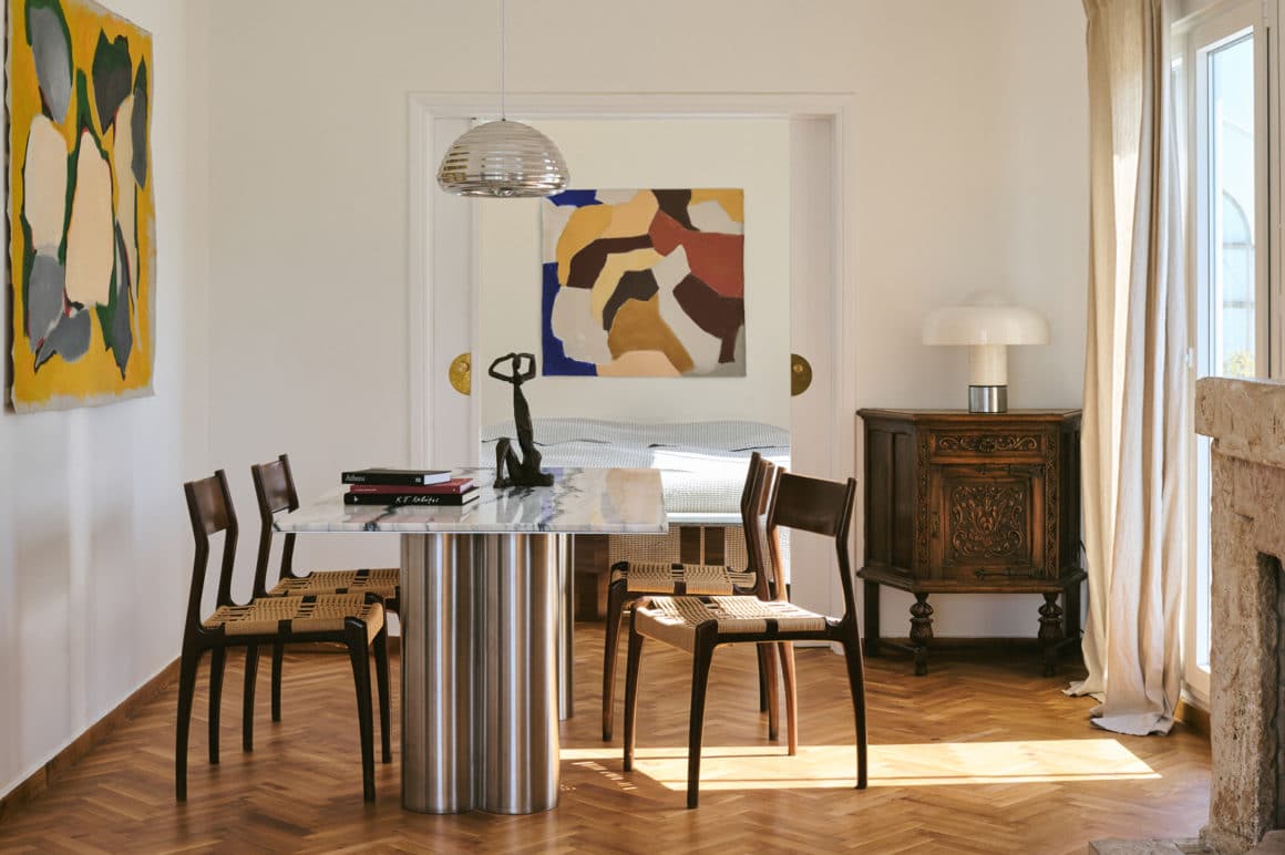 Athenian penthouse living space with custom marble furniture and views of the Acropolis.