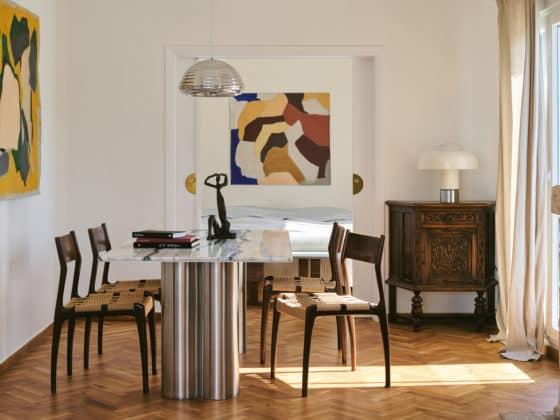 Athenian penthouse living space with custom marble furniture and views of the Acropolis.