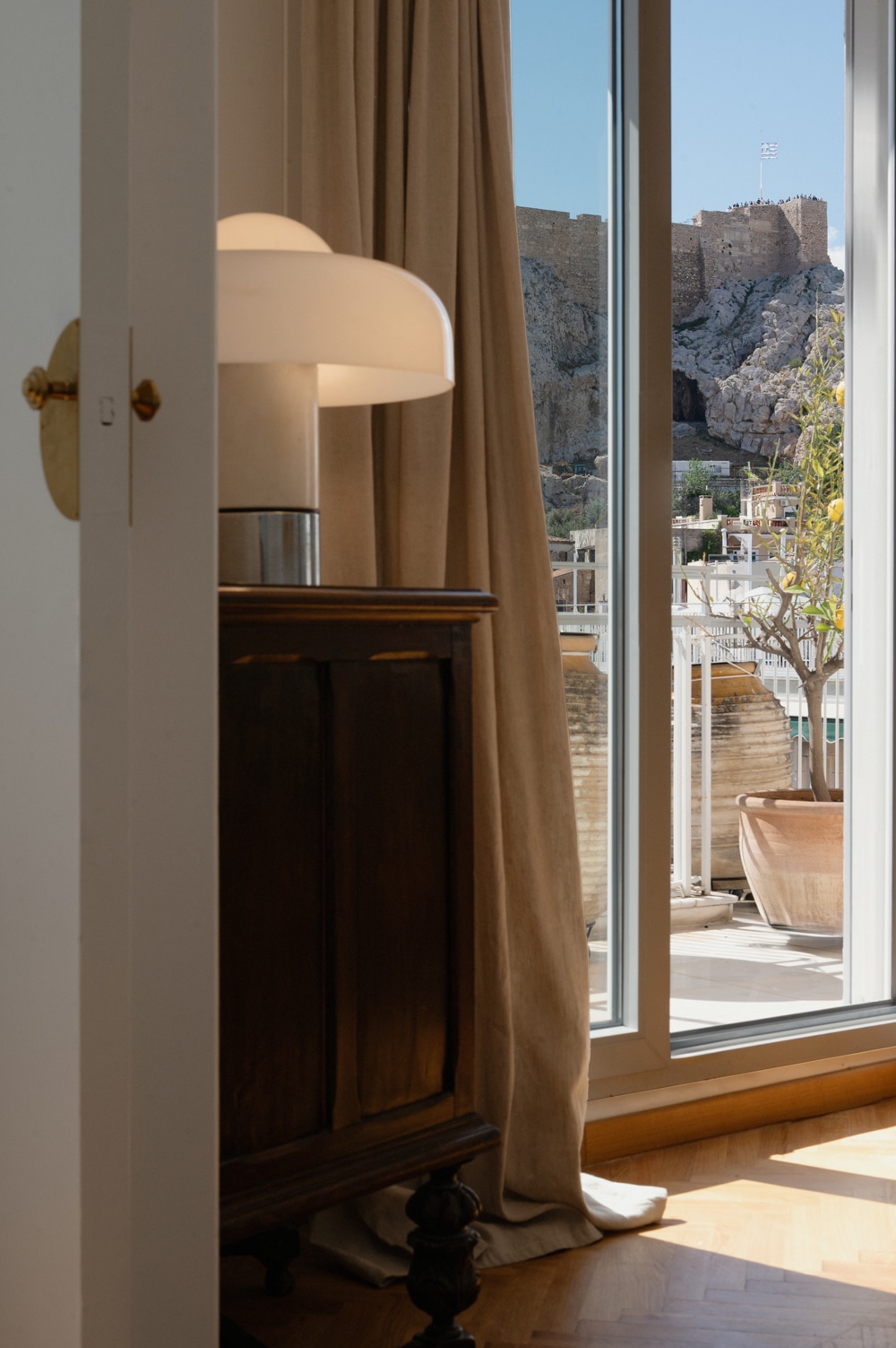 penthouse framed by views toward the Acropolis.