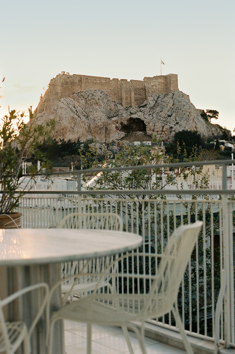 terrace with monumental Dionysos marble bench overlooking the Acropolis.