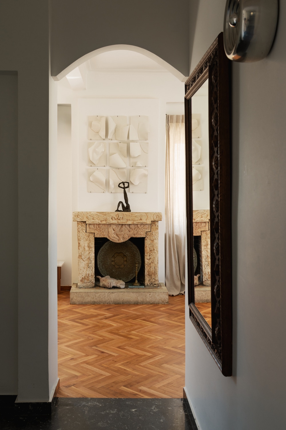 Stone fireplace inspired by Greco-Persian folk art.