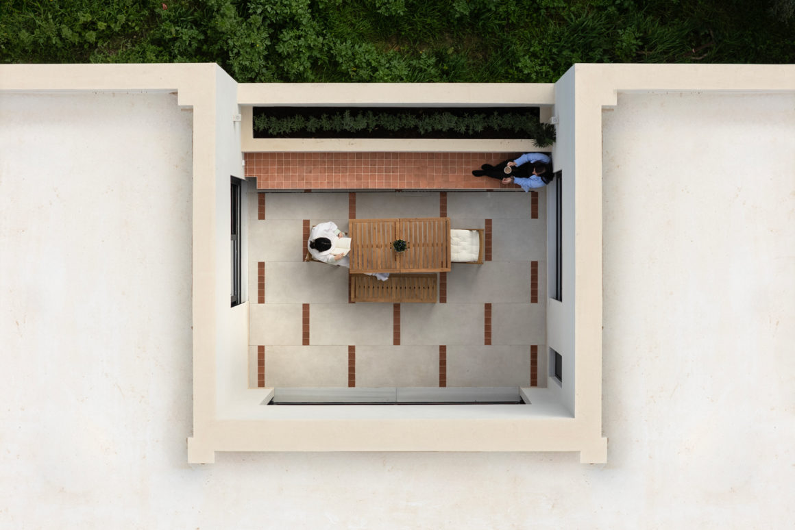 Exterior view of single-storey Patras house showing interlaced voids and courtyards