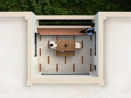 Exterior view of single-storey Patras house showing interlaced voids and courtyards