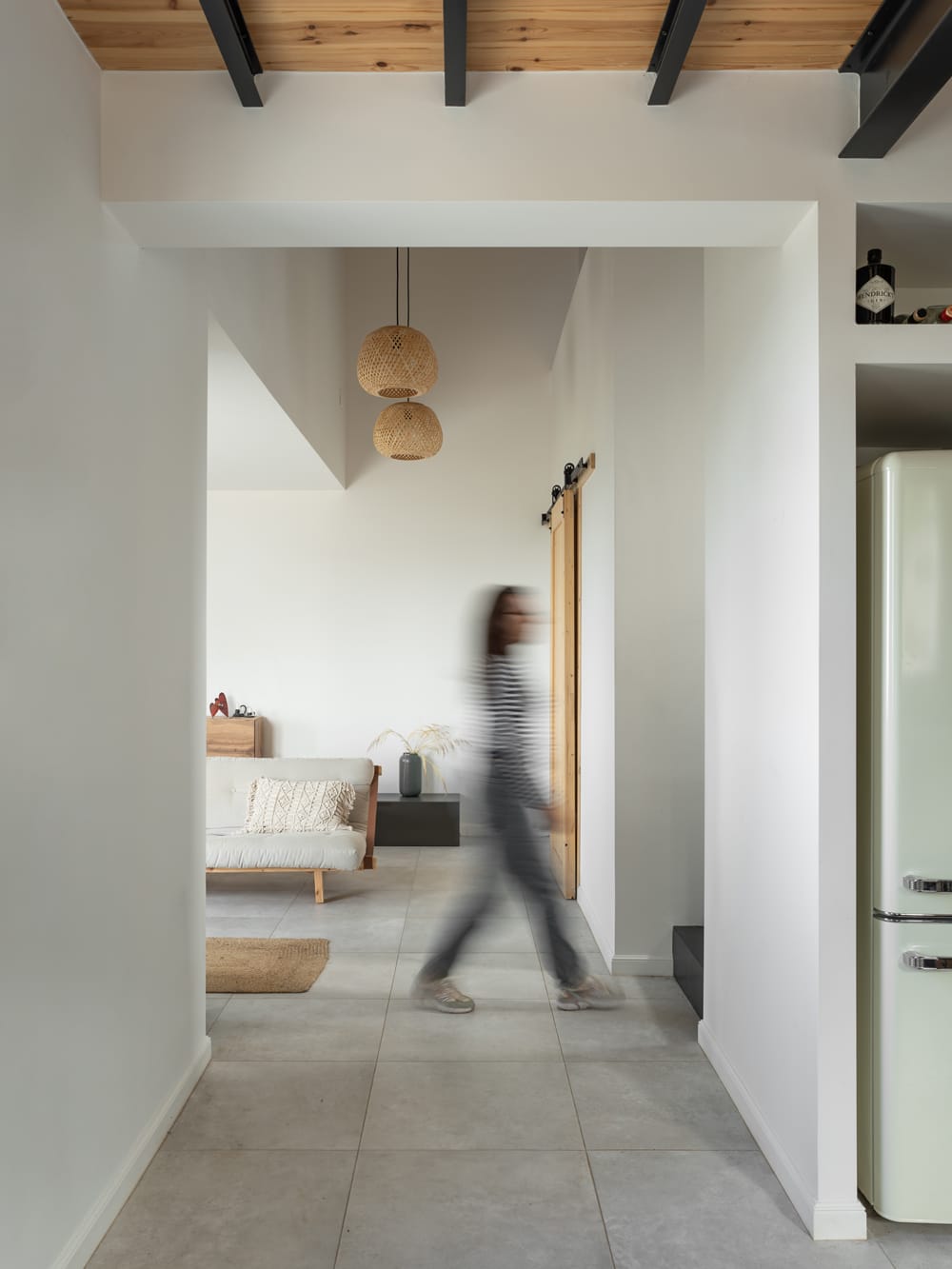 Interior open-plan living space with kitchen and minimal contemporary finishes