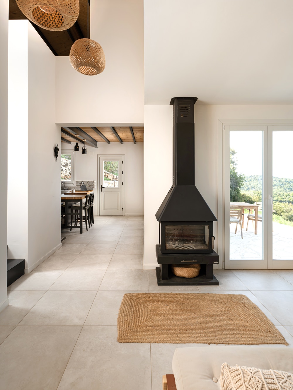 nterior open-plan living space with fireplace and minimal contemporary finishes