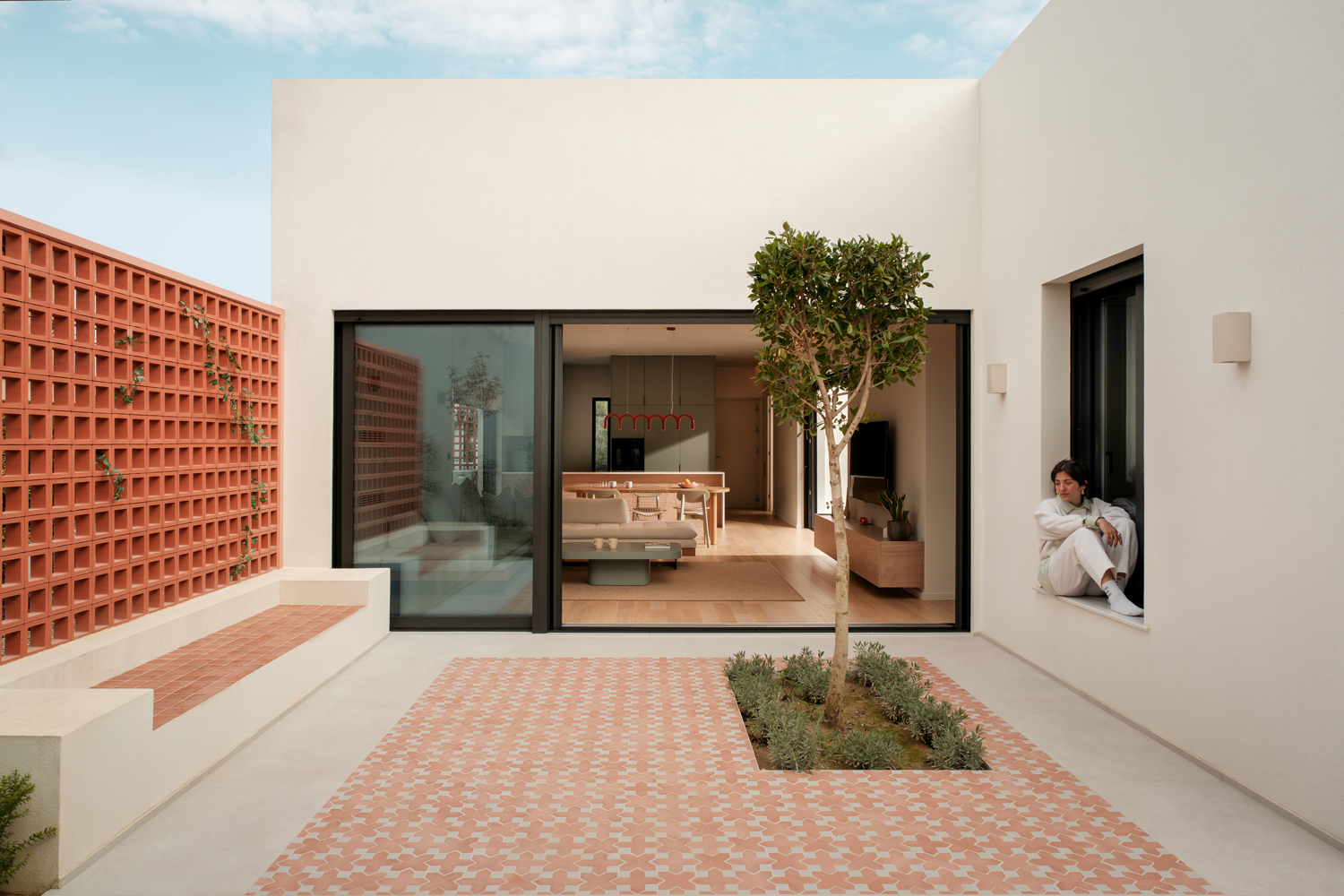 Outdoor courtyard finished with terracotta tiles and planting