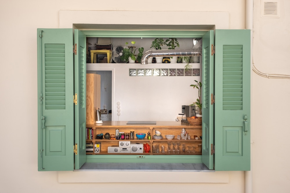 View of the studio apartment interior showing exposed services and wooden elements