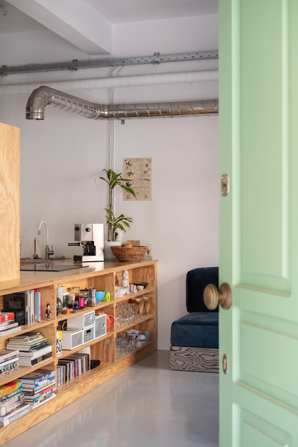 Detail of pine plywood cabinetry integrated into the apartment partition