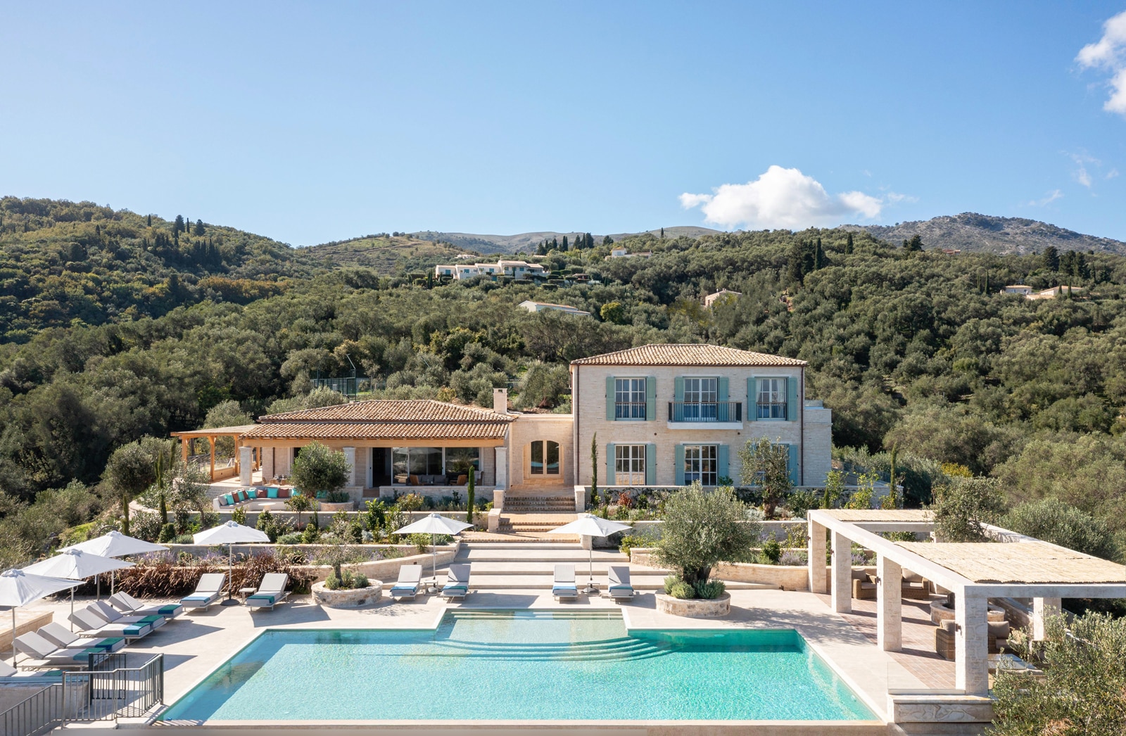 Exterior view of Villa Beliha embedded in the hillside of north-east Corfu