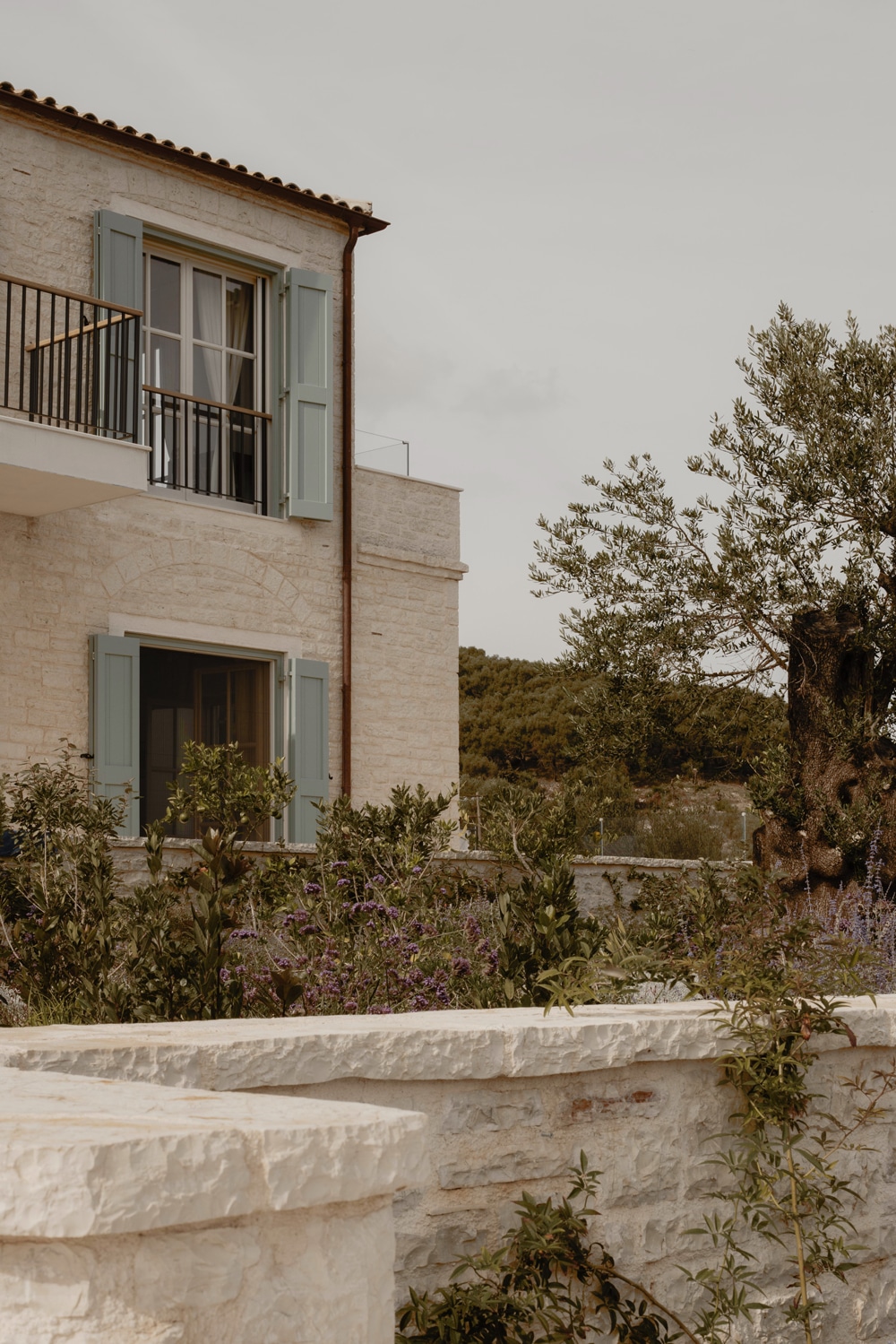 Stepped stone volumes of the villa following the natural terrain