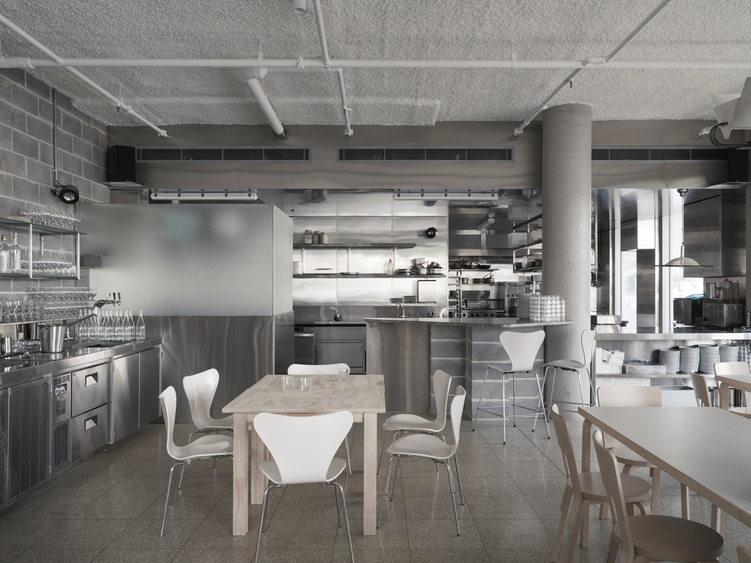 Wide shot of the 100-seat dining area at Homer Rogue Taverna designed by AP Design House