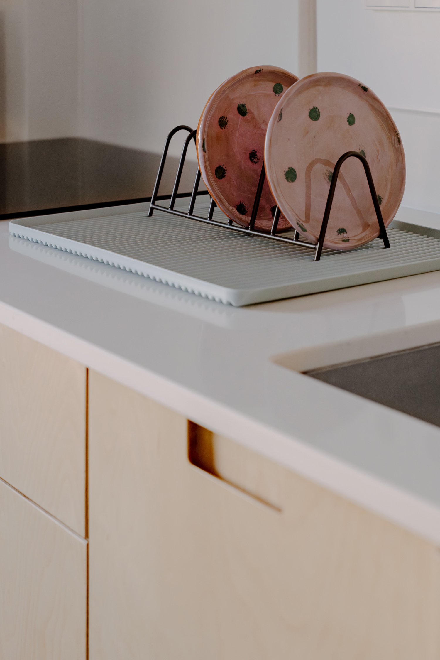 Plywood kitchen with white quartz countertop and island