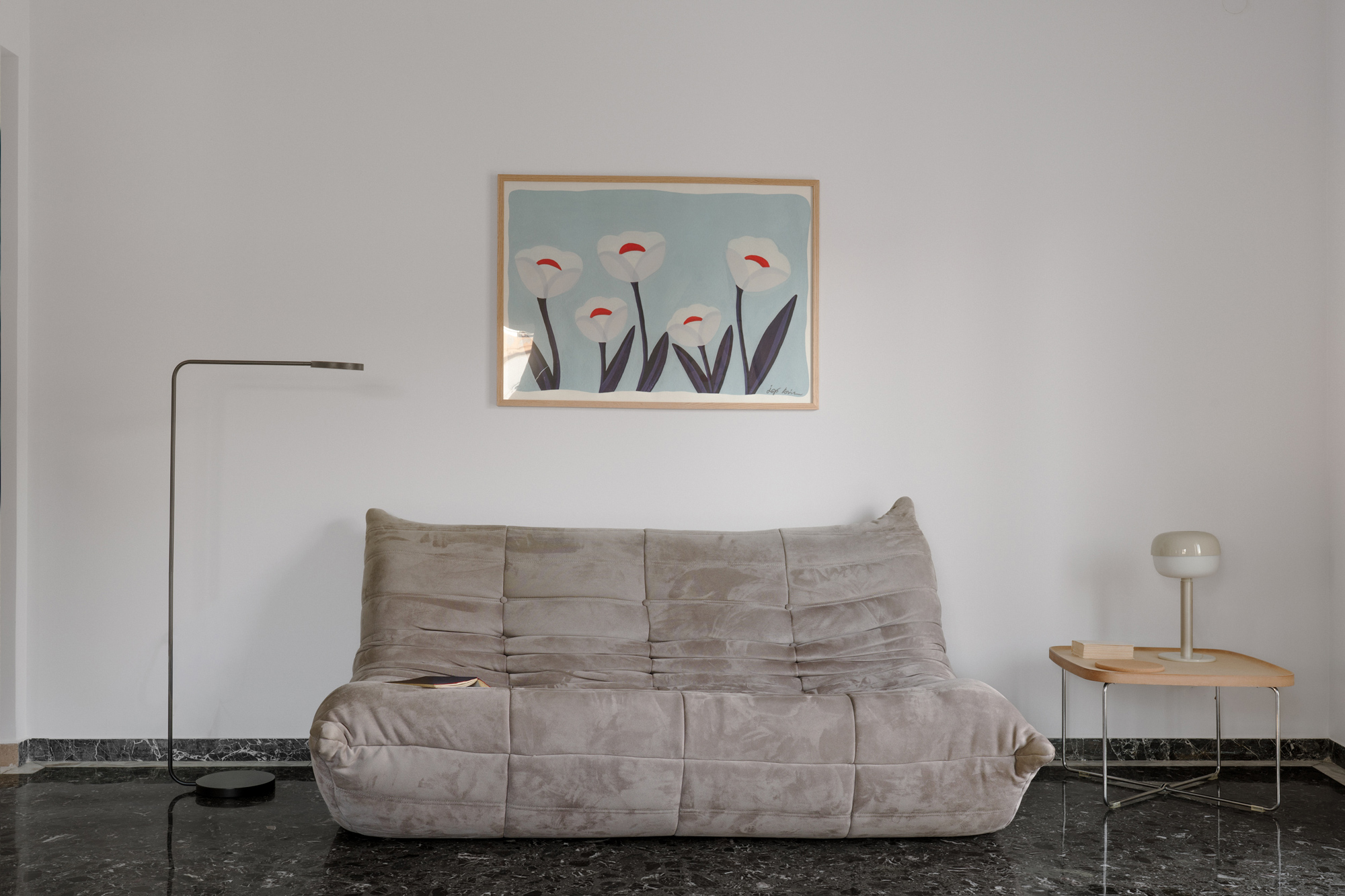 Living room with colourful Aunt Chair and contemporary artwork