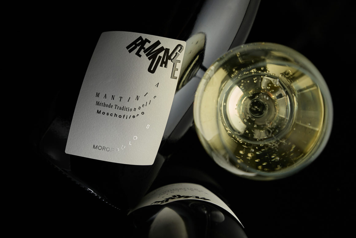 REMUAGE sparkling wine bottle featuring minimalist label with flowing typography inspired by the remuage process