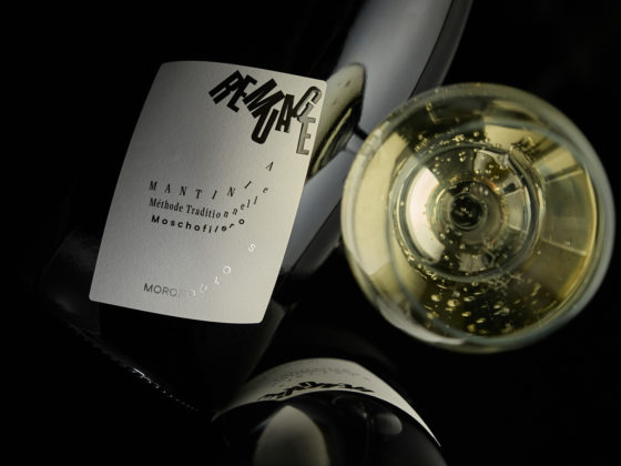 REMUAGE sparkling wine bottle featuring minimalist label with flowing typography inspired by the remuage process