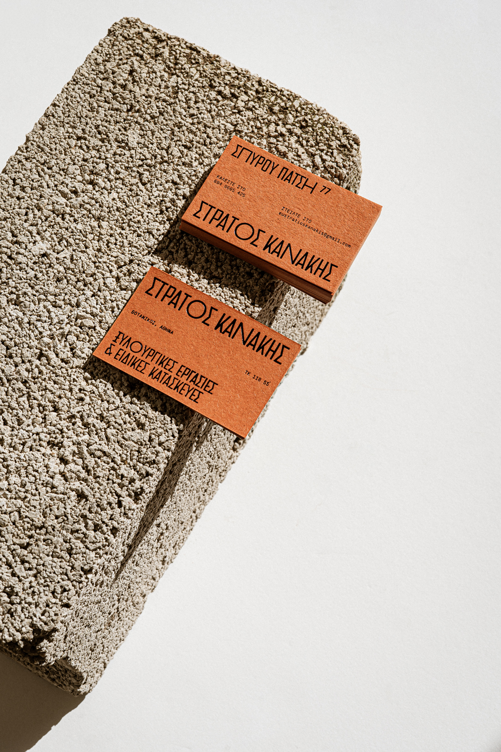 Close-up of printed brand materials on Gmund Naturals paper in orange tone