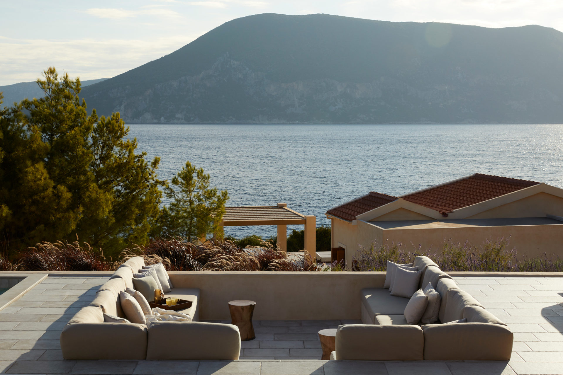 Exterior view of Emelisse Nature Resort villas in Kefalonia with Ionian Sea backdrop