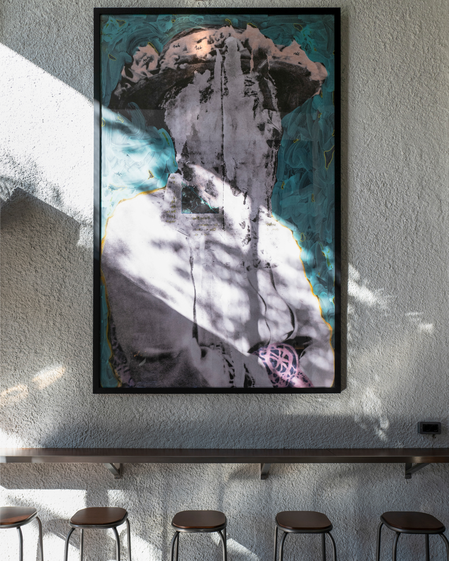 Detail of rough cast plaster wall and warm wooden surfaces