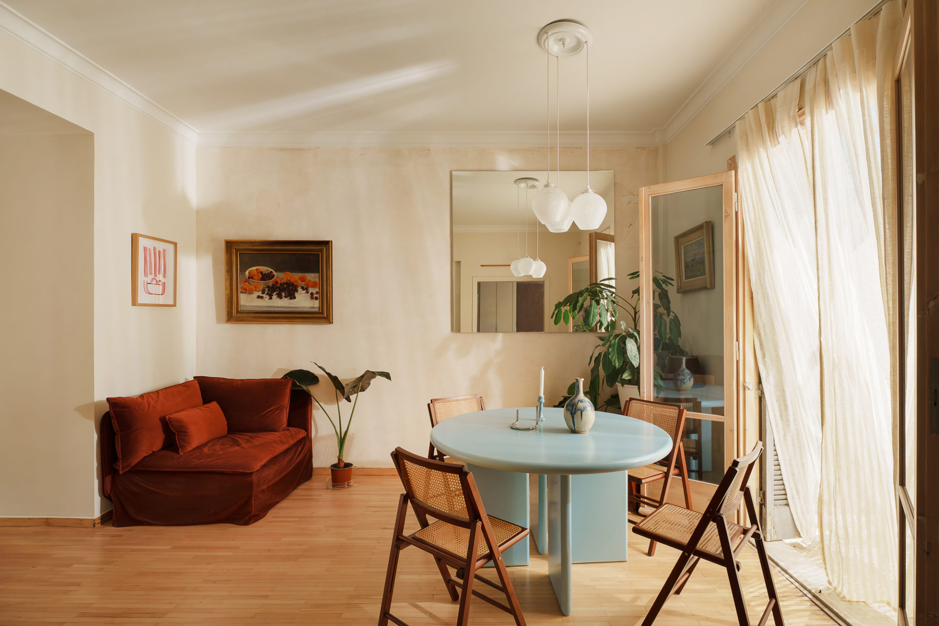 Living space with timber floors in renovated Patissia apartment