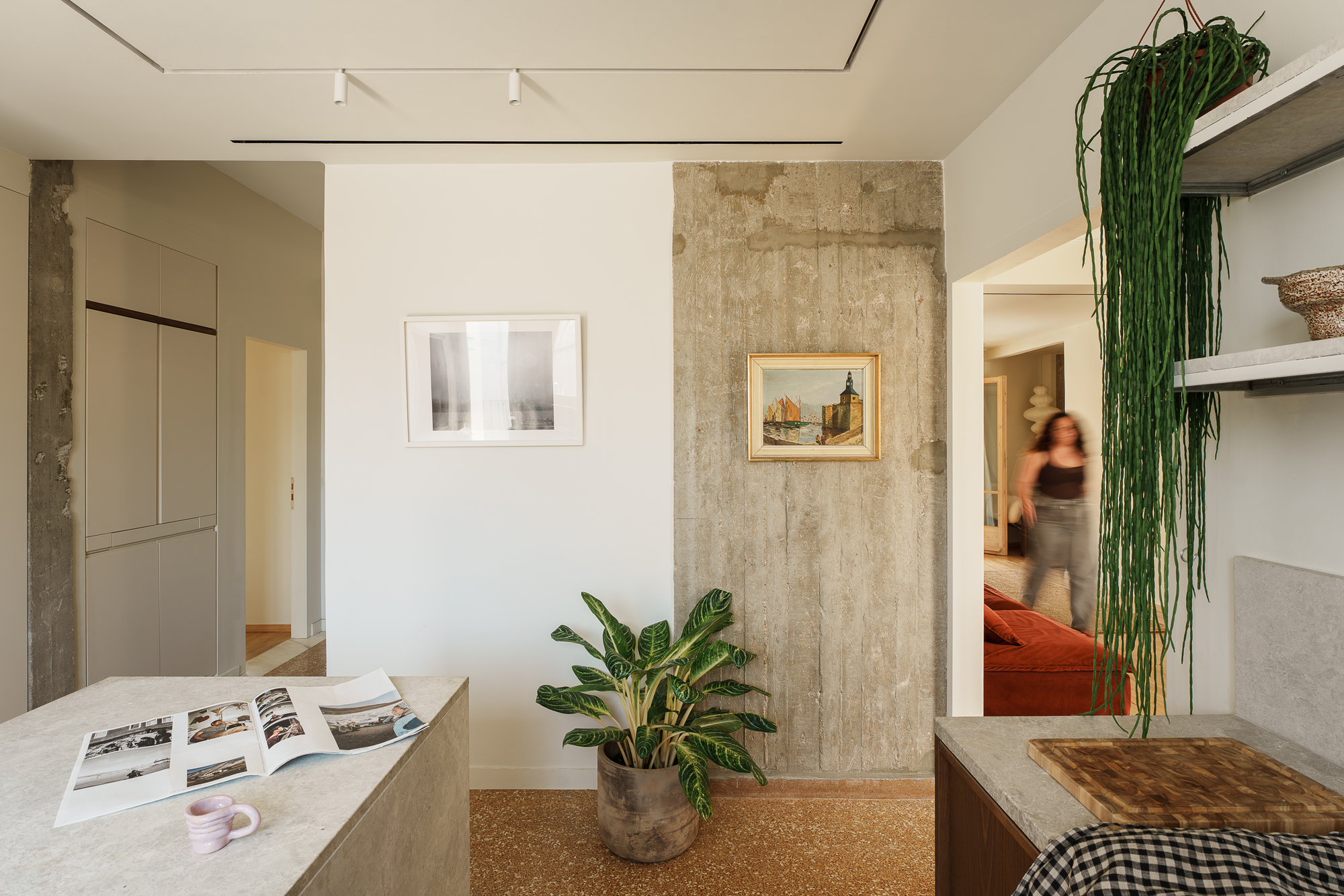 Central kitchen space connecting living areas and bedrooms in Athens apartment
