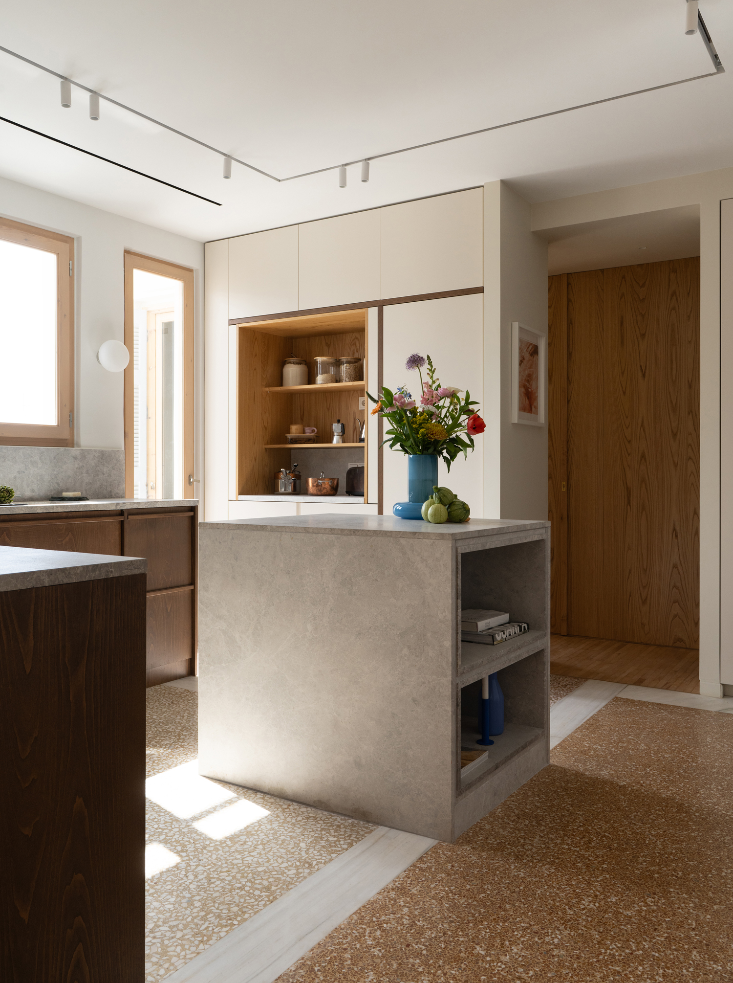 Open-plan kitchen at centre of renovated Athens apartment by KAN Atelier