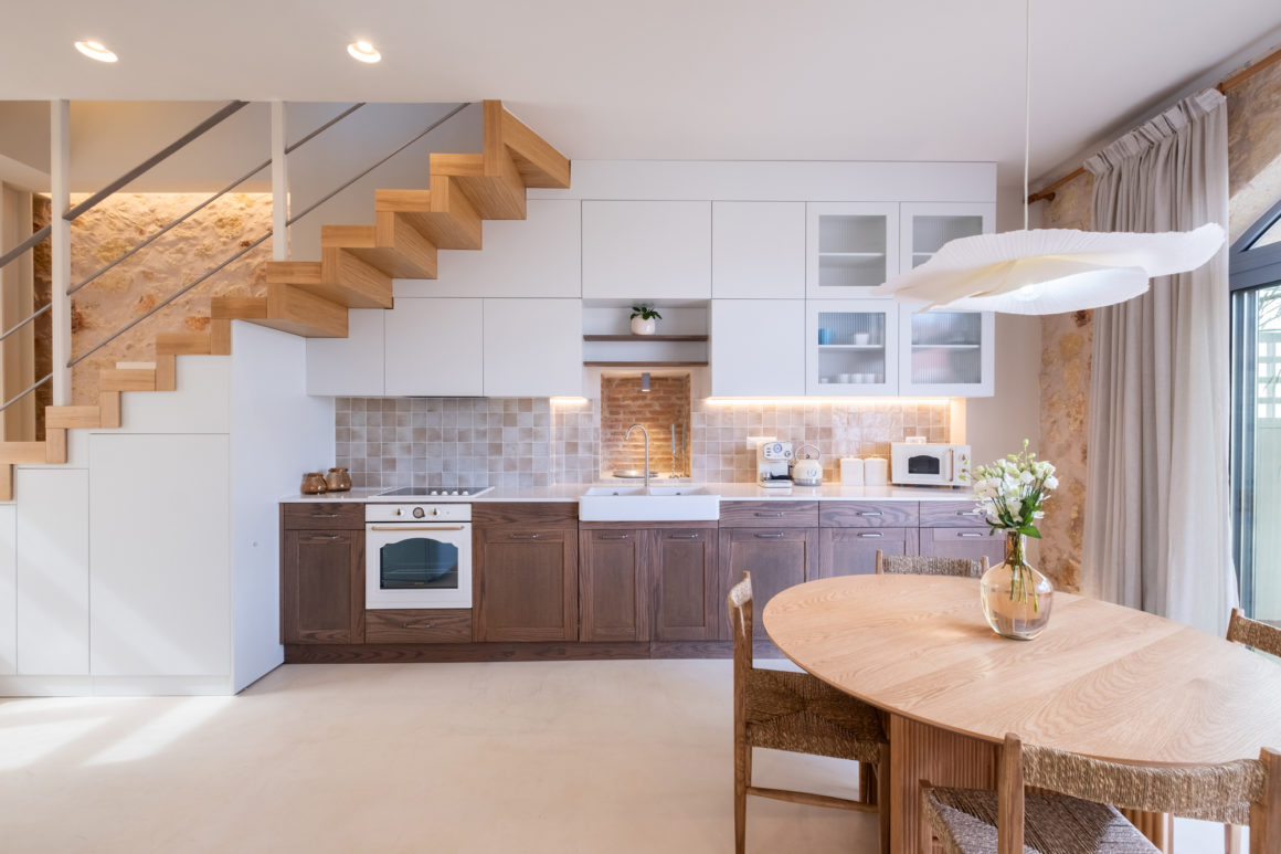 View of 1920s Cretan stone house topped with lightweight contemporary addition