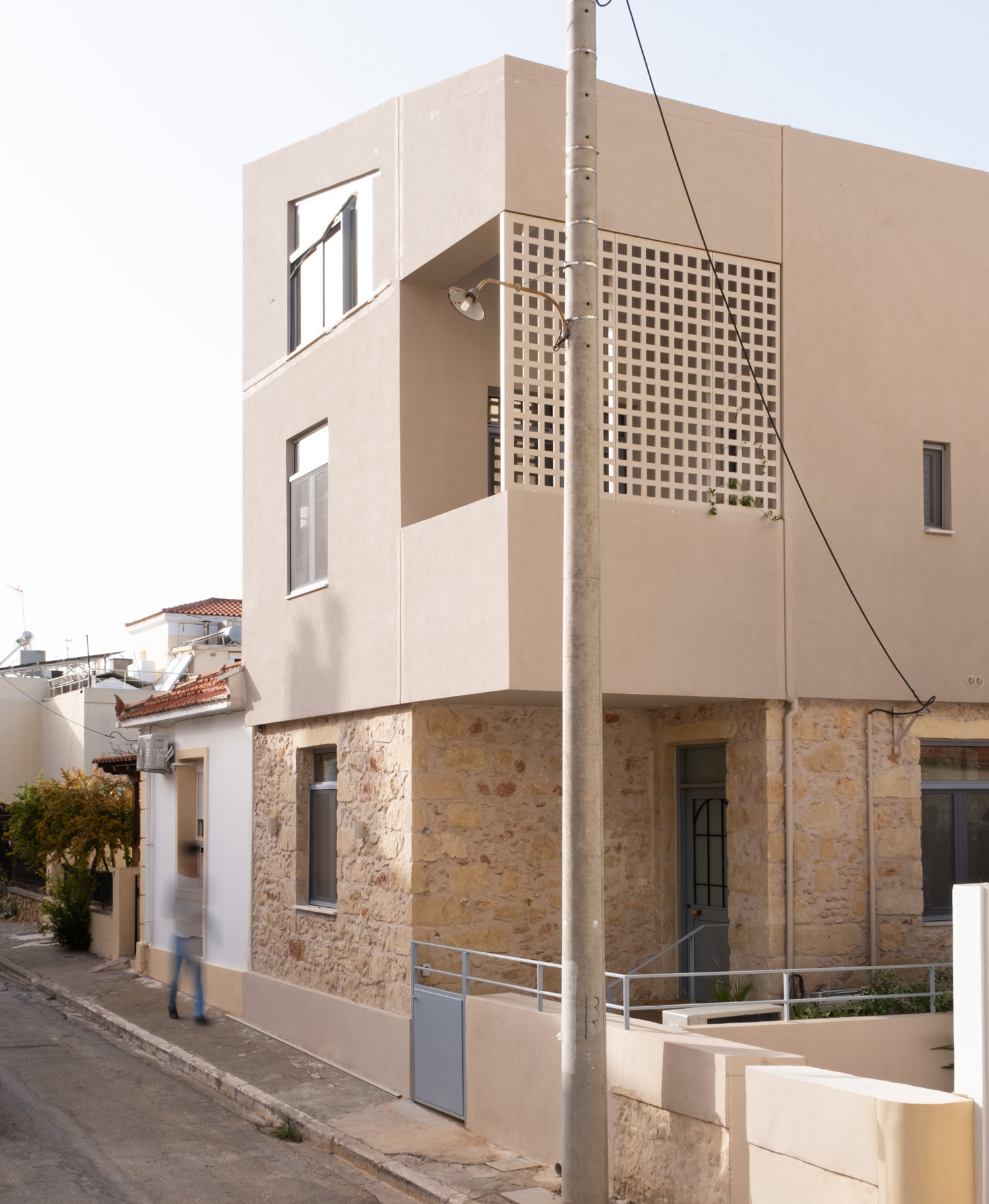Stone house in Crete with metal-framed vertical extension by Georgina Andrei