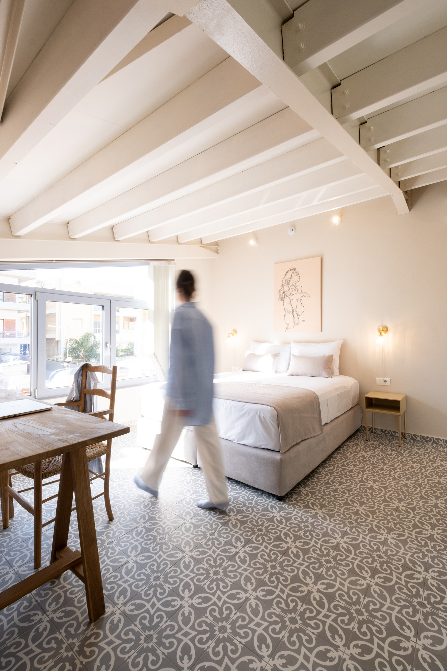 Bedroom with varied ceiling heights inside metal-framed extension