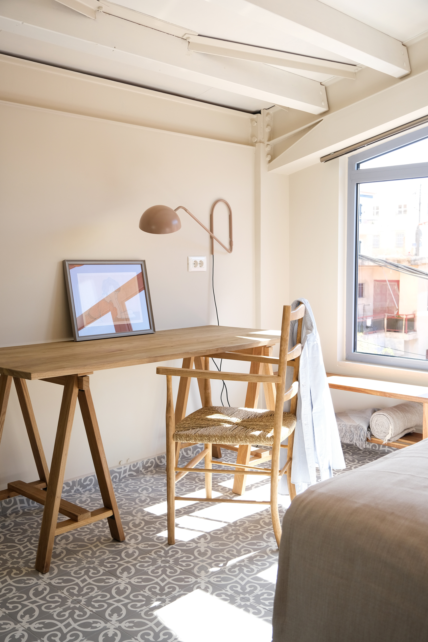 Play of light and shadow across stone and smooth surfaces