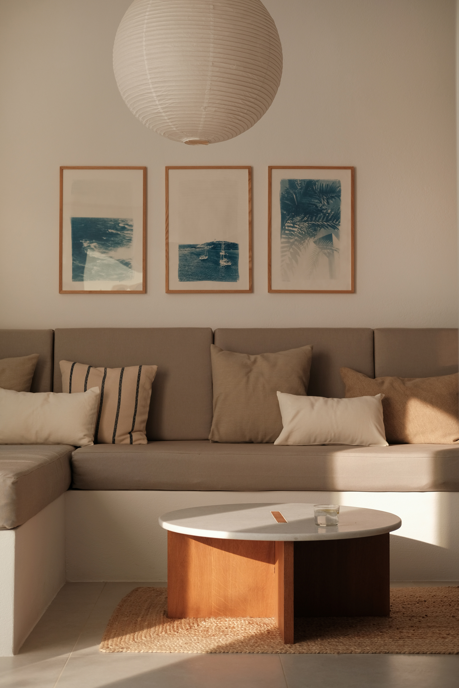 Interior of Mazi Paros with oak surfaces and natural light entering through large openings