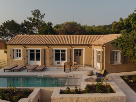 Exterior view of F–topia Villas by ACRE Architecture set within the Mediterranean landscape of Kefalonia