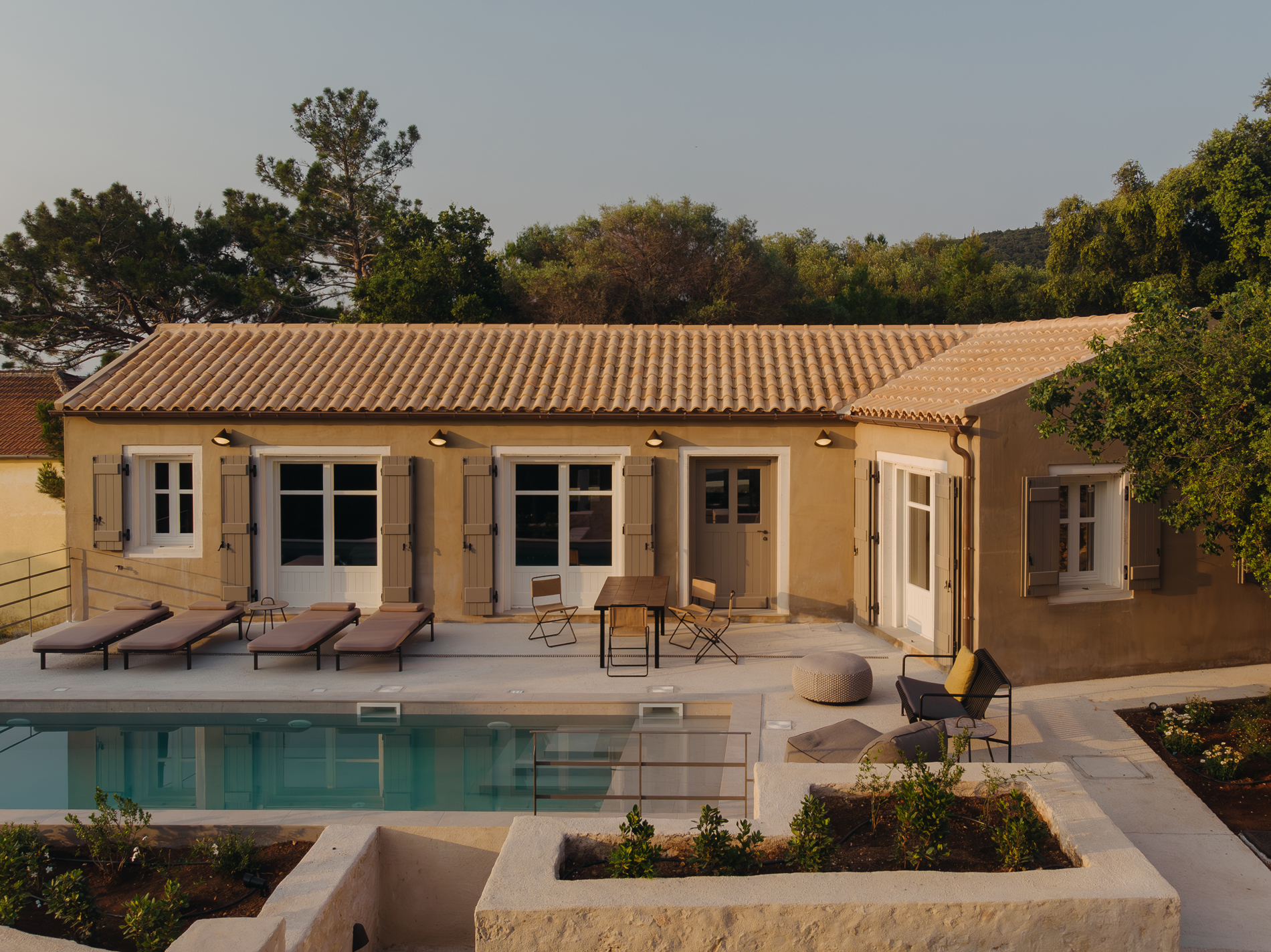 Exterior view of F–topia Villas by ACRE Architecture set within the Mediterranean landscape of Kefalonia