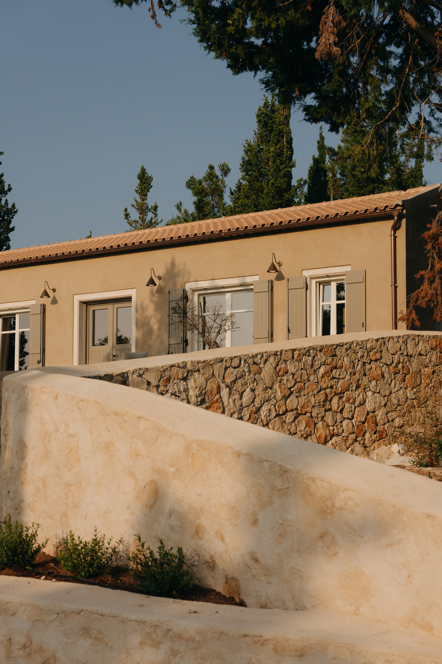 Stone and plaster summer houses overlooking the sea in northern Kefalonia