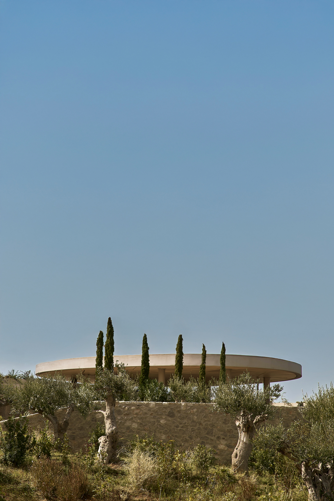 Landscape view showing the resort’s low-rise architecture embedded into the terrain